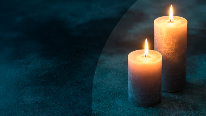 Lit candles against a dark background. New report on infant mortality now available.