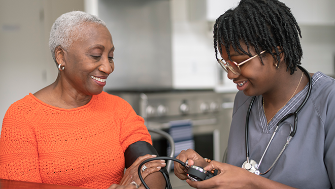 A nurse takes an older female patient&rsquo;s blood pressure. Two-thirds of people 85 and older have high blood pressure.