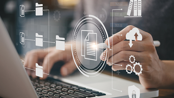 Hands using a laptop tapping virtual icons representing folders, documents, and data organization