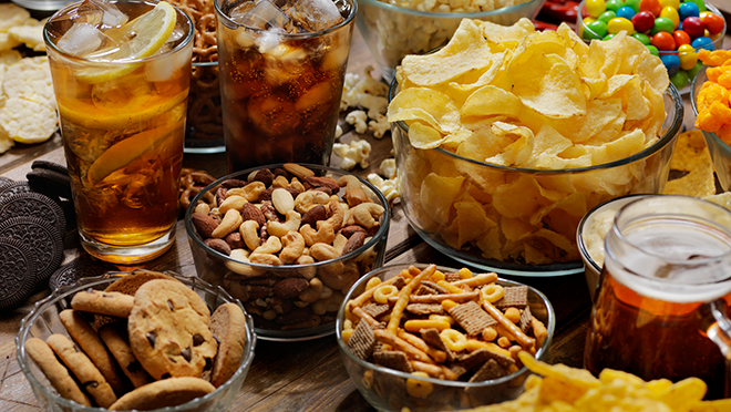 Image of ultra processed food, including chips, pretzels, cookies, and soda