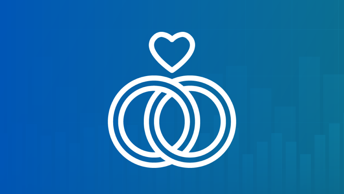 An outline of a heart above two intersecting wedding rings