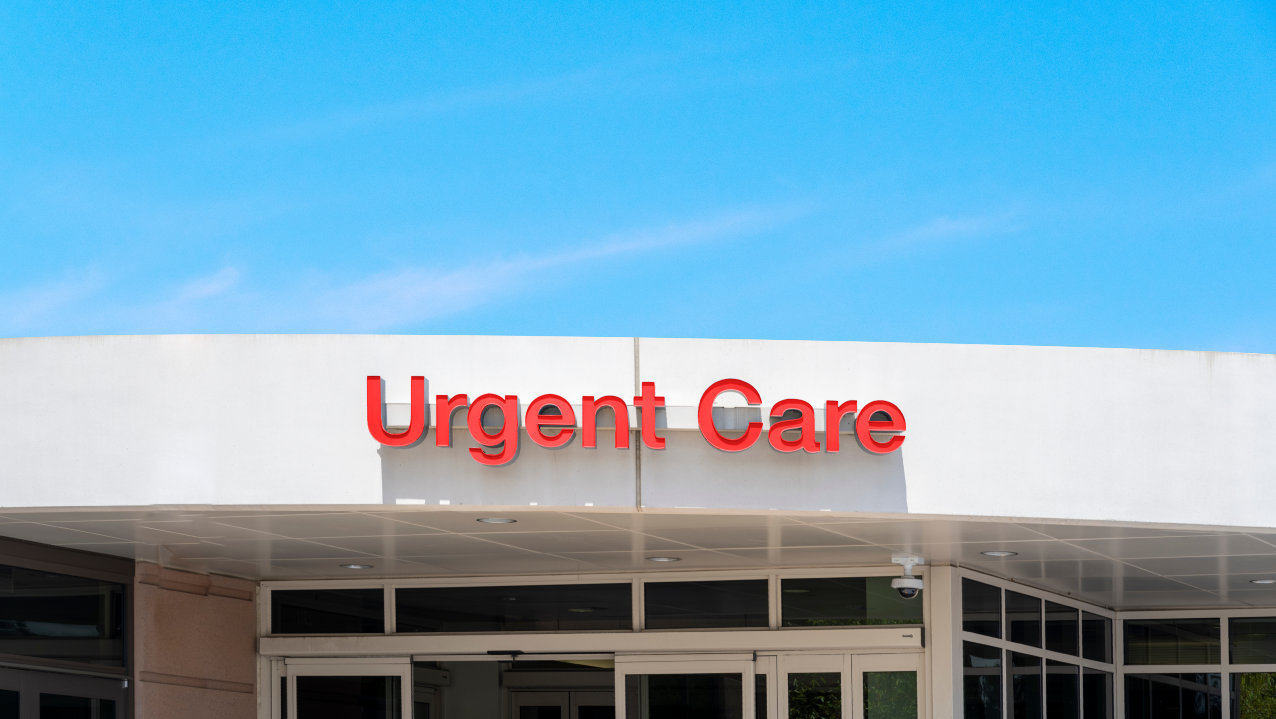 A building with an urgent care sign on the building