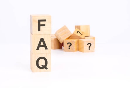 Decorative: wooden blocks labeled with "FAQ"