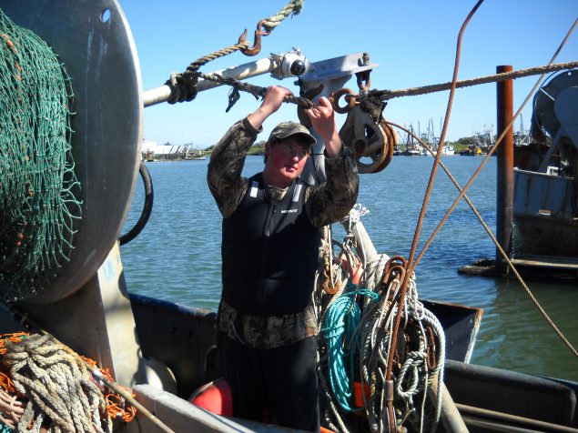 12-year commercial fishing veteran Brett Smith works the line in the 'Rogue' flotation vest created by Kent Safety Products.