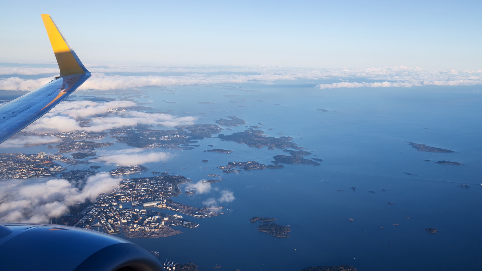 Helsinki Seaport and the Gulf of Finland from an airplane window during takeoff.