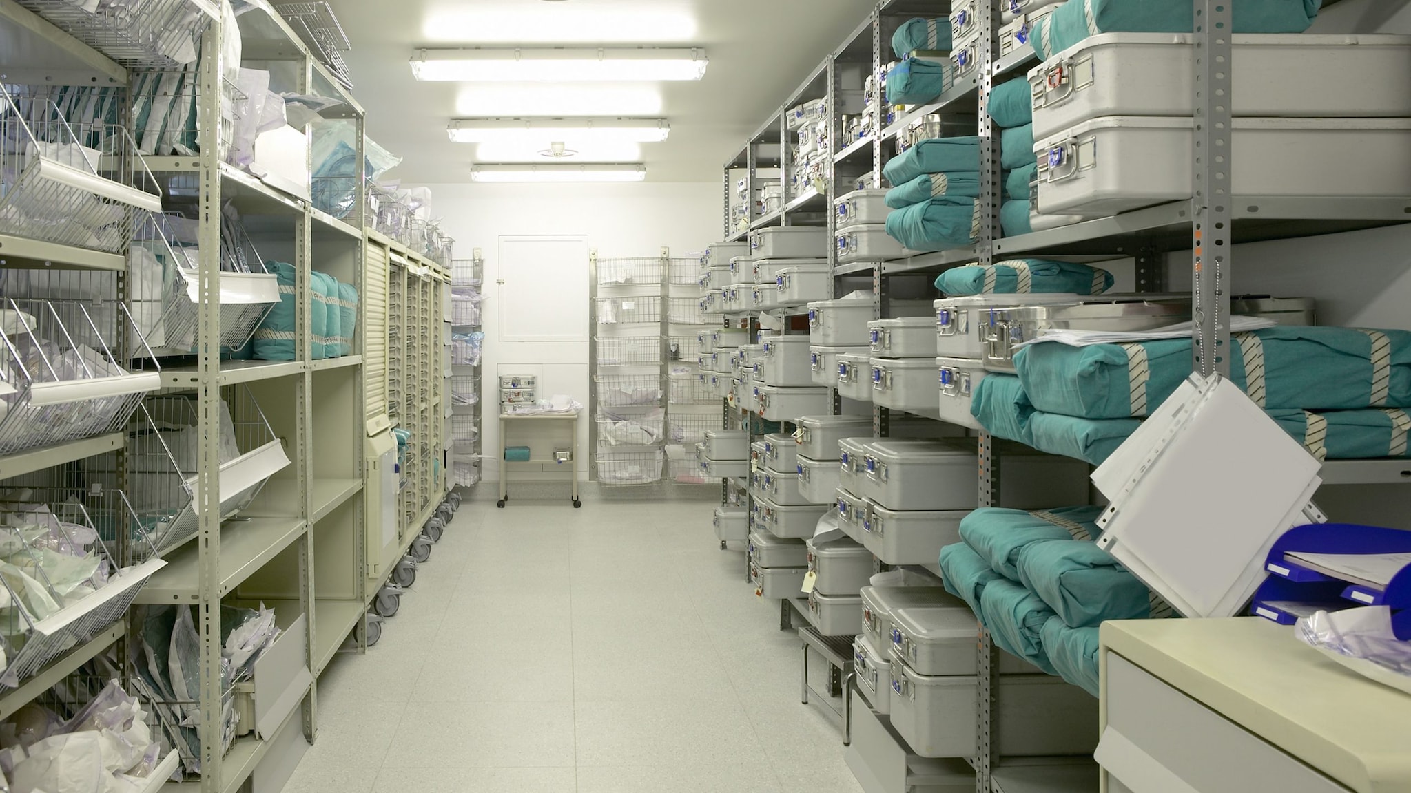 Inventory closet and shelves filled with personal protective equipment and healthcare supplies