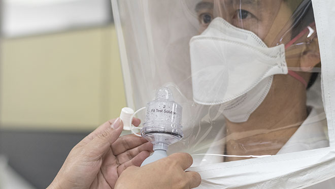 A worker undergoing qualitative fit testing