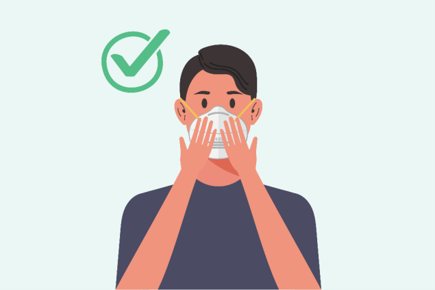 Person pressing respirator to face with a green check mark to signal there a no gaps for breath to escape.