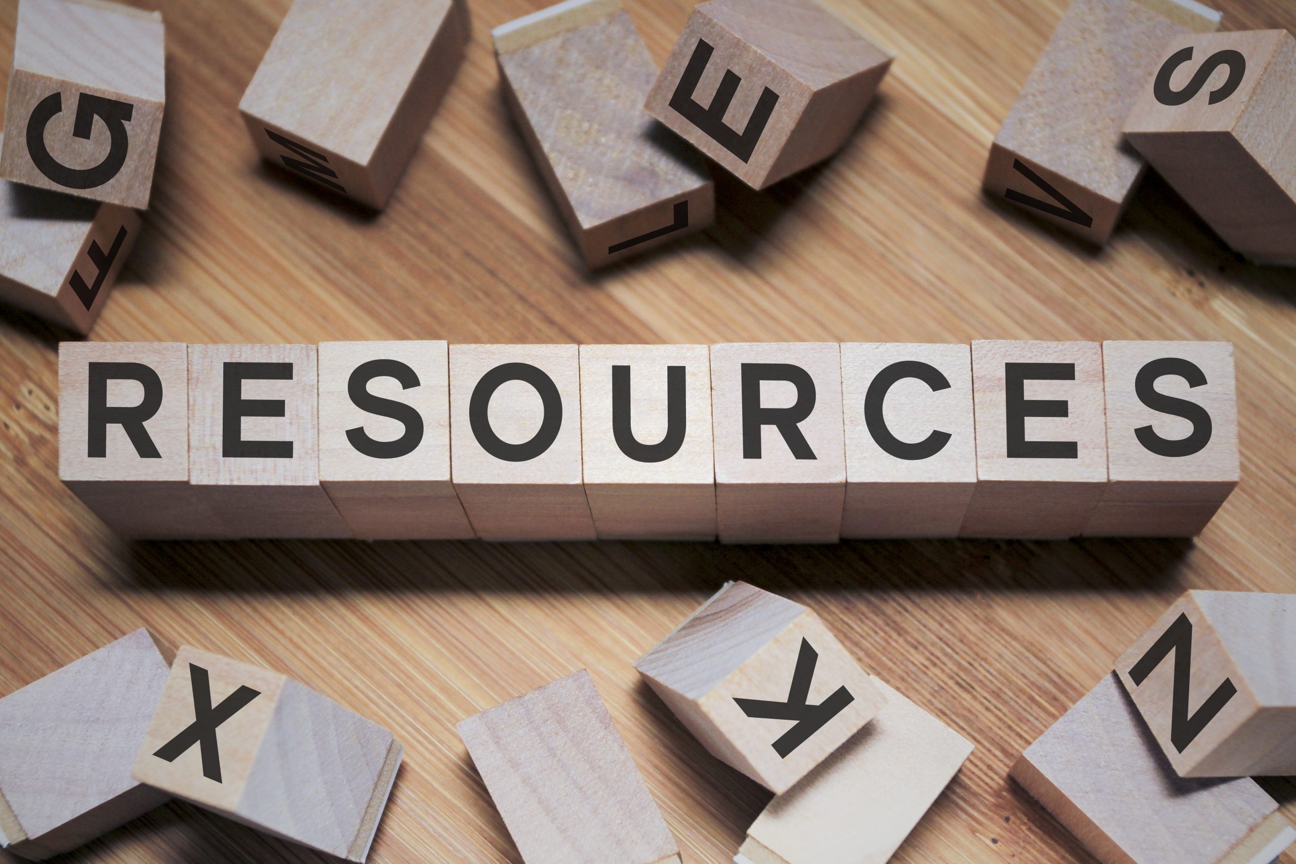 the word "resources" spelled out on wooden blocks