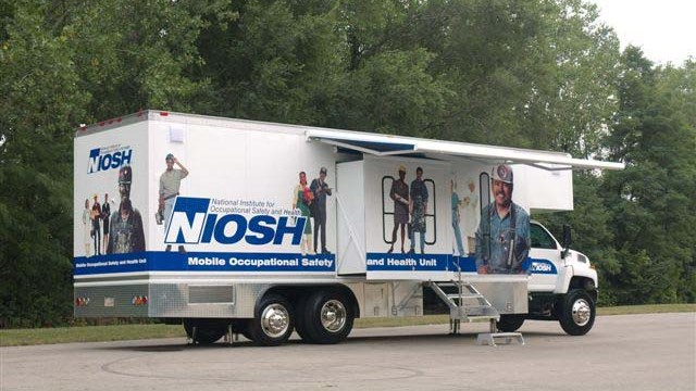 NIOSH mobile screening unit for black lung screenings set up in a parking lot.