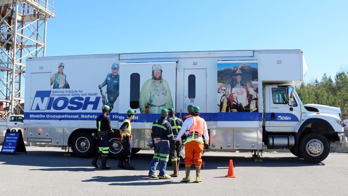Coal miners enter the NIOSH mobile testing unit to be screened for black lung.