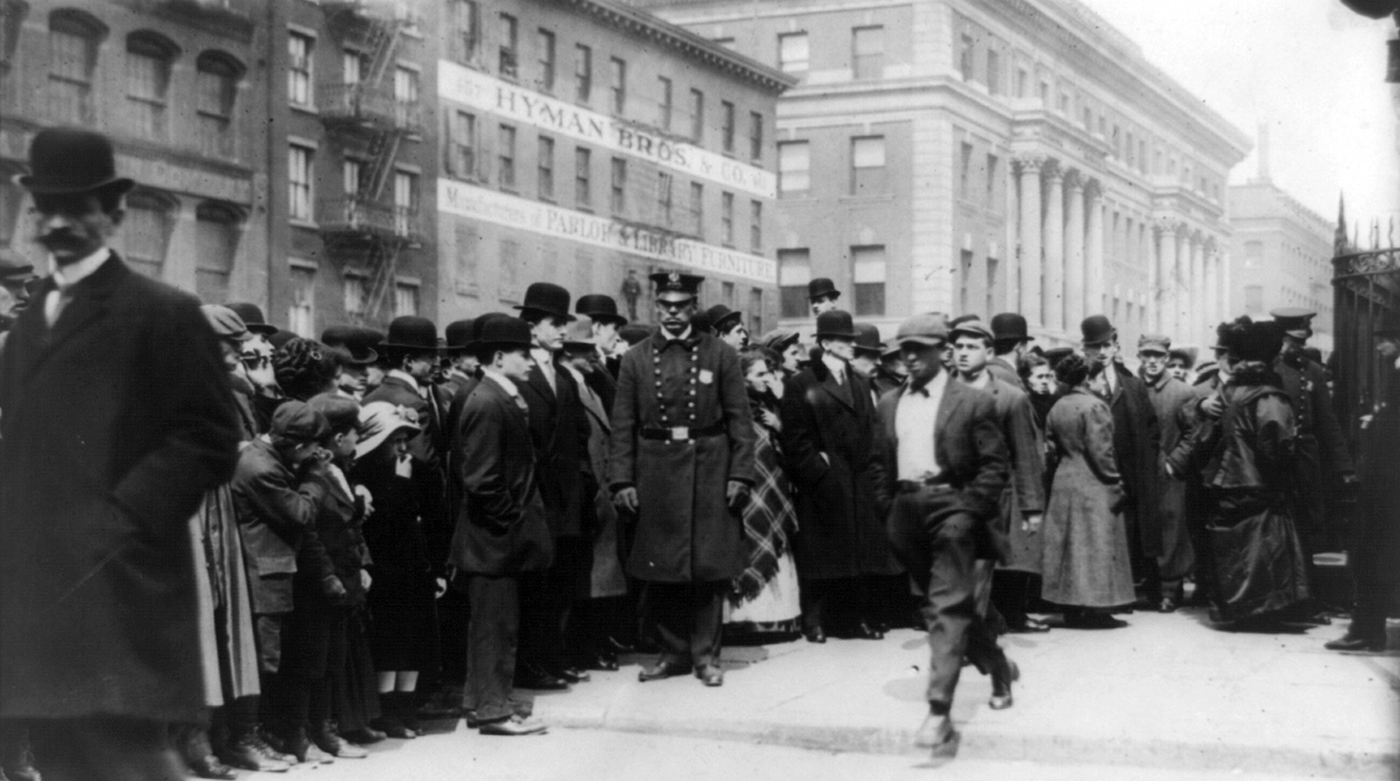 Photo by Library of Congress Families of the victims of the 1911 Triangle Shirtwaist Factory fire gather outside a morgue.