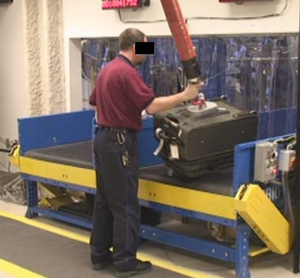 Image of person using machine to test system.