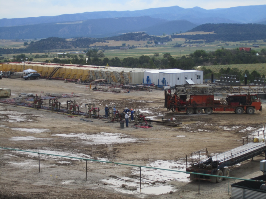 Separators, flowback tanks, and water tanks on a well pad with multiple well heads