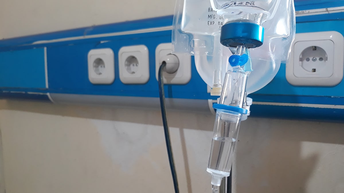 Hospital infusion bottle hooked to IV
