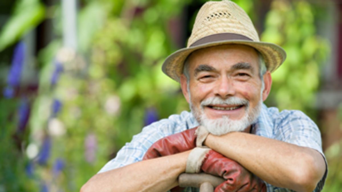 Smiling older outdoor worker