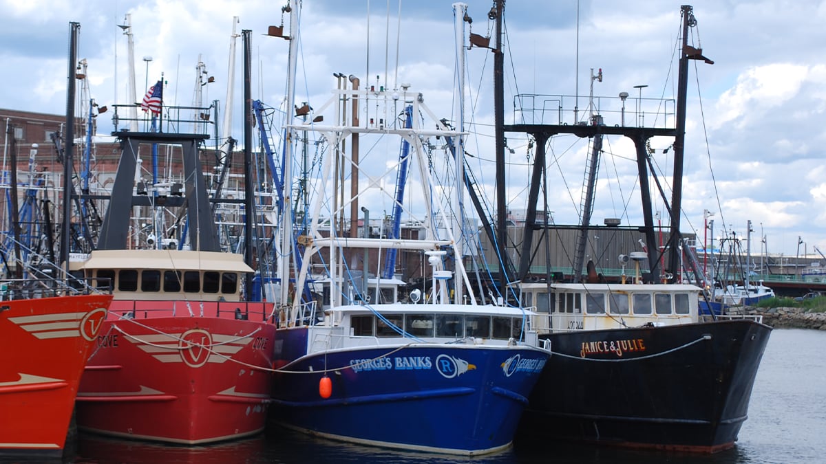 A close up photo of New Bedford commercial fishing boats tied up at the dock. Photo by NIOSH.