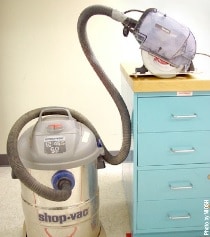 Attaching a regular shop vacuum to a dust-collecting circular saw