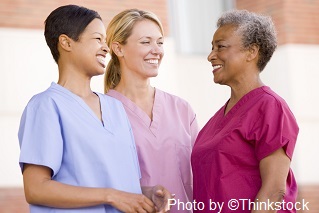 M4B Three nurses standing are standing and smiling