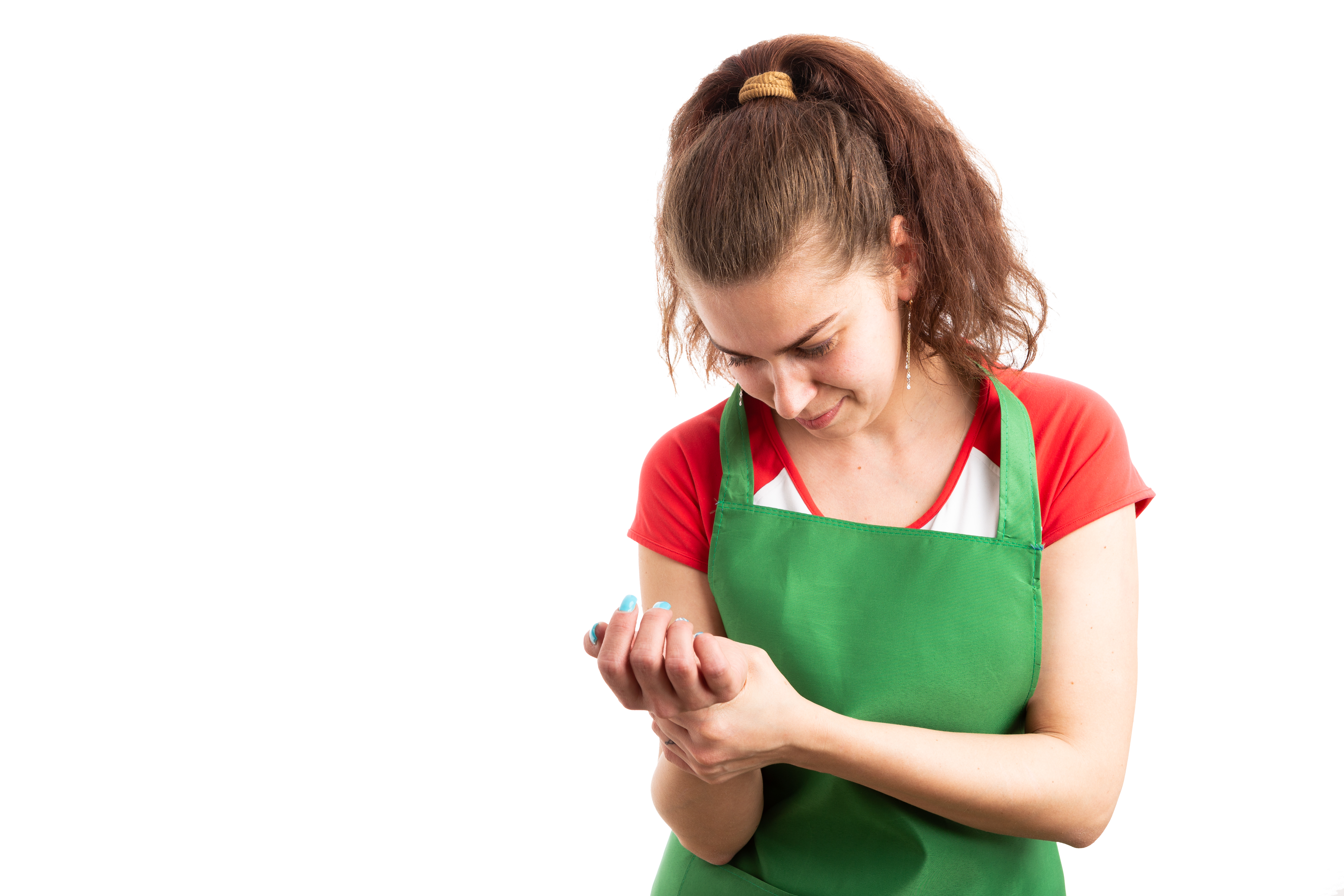 Woman in apron working in a grocery store.