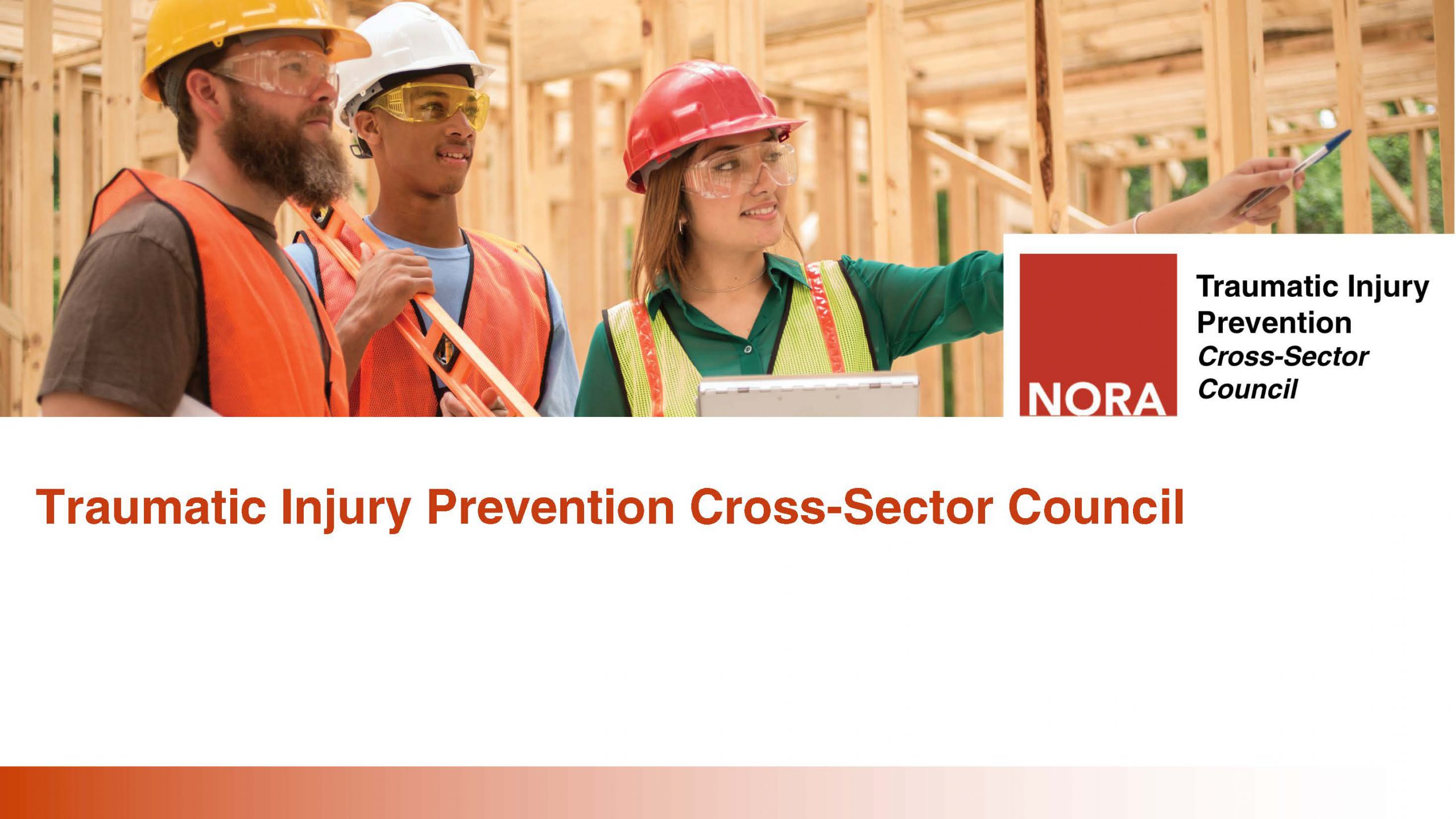 Three workers stand in a construction site.