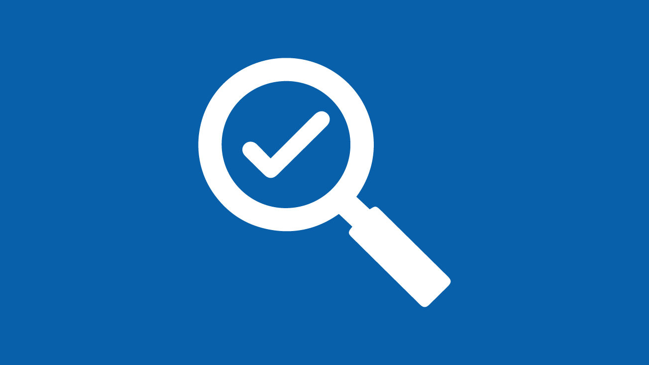Magnifying glass with checkmark on blue background