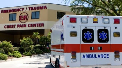 Ambulance parked outside a hospital emergency department