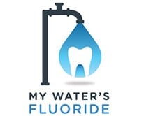A logo for the My Water's Fluoride web application that shows a drinking water pipe with a droplet of water. Inside the droplet of water is an image of a healthy tooth.