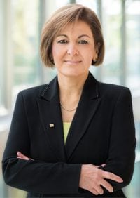 Portrait of Dr. Maryam Daneshvar, a woman with short brown hair, a black blazer, and a necklace on.