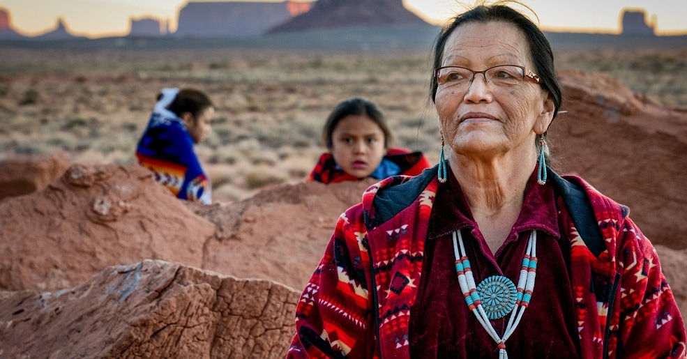 Native American Grandmother, Grandson and Granddaughter in Monument Valley Arizona at Dawn