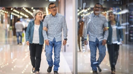 Couple walking in an indoor mall.