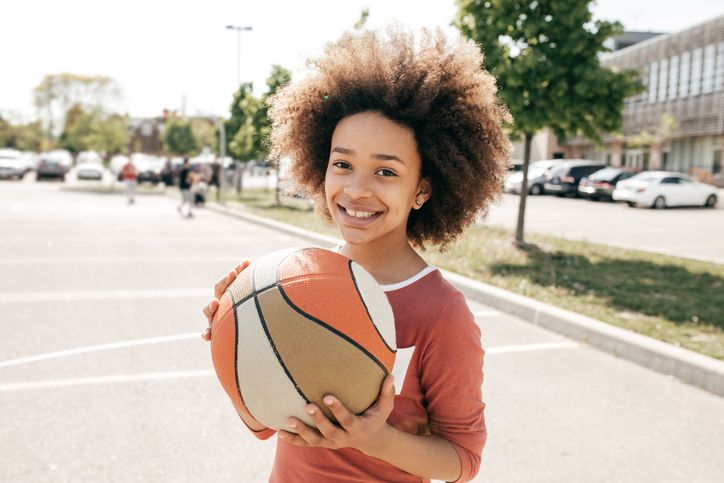Teenage boy holding a basketball