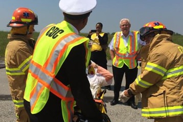 A CDC quarantine public health officer, and EMS responders to assess the health of the “survivor."