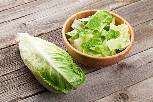 Chopped romaine lettuce in a wooden bowl