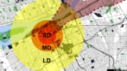 An arial view of a city map with colored circles and shapes indicating areas of blast/thermal damage and radioactive fallout.