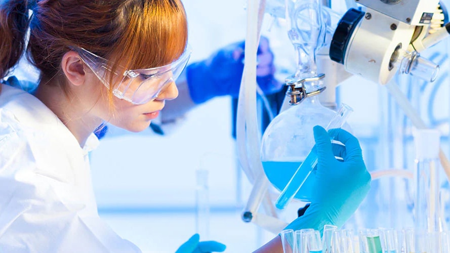 Lab technician analyzing test tube