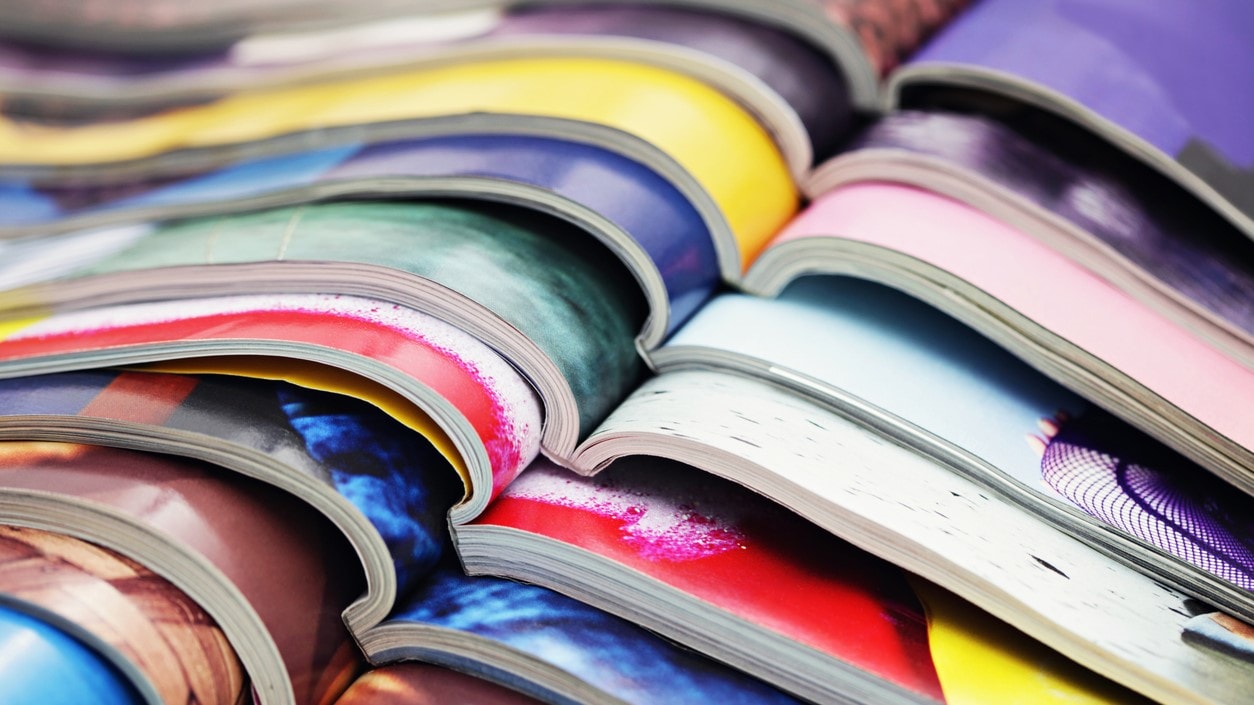 Stack of colorful journal magazines.