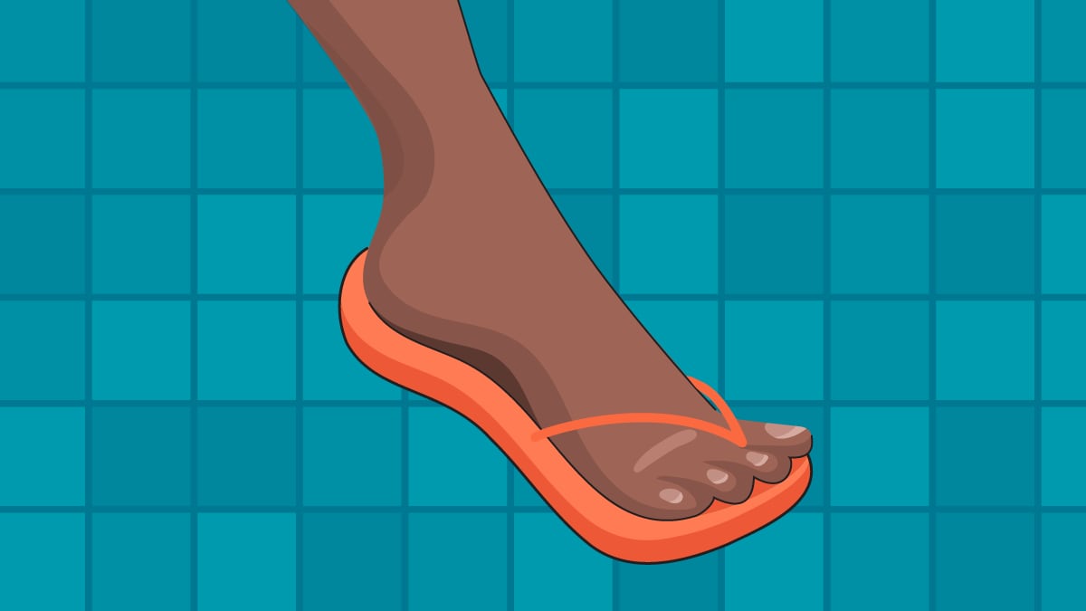 image of foot wearing a flip-flop on a tile floor