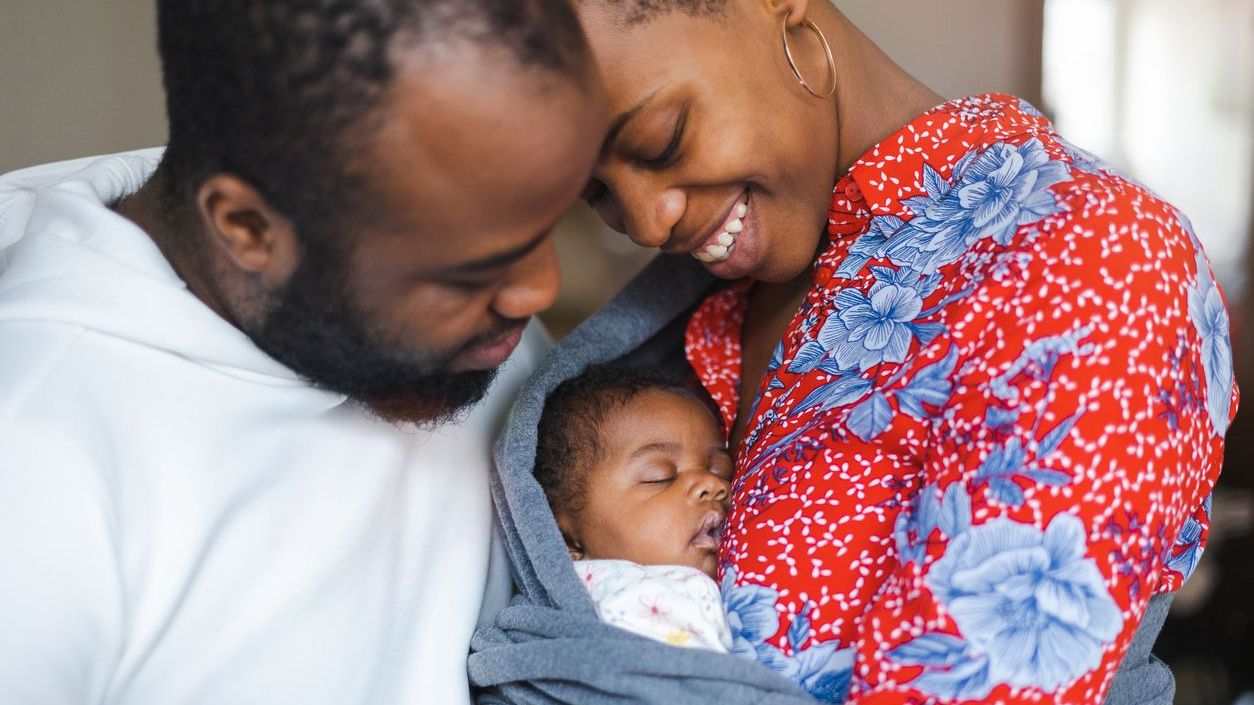 New parents looking at newborn