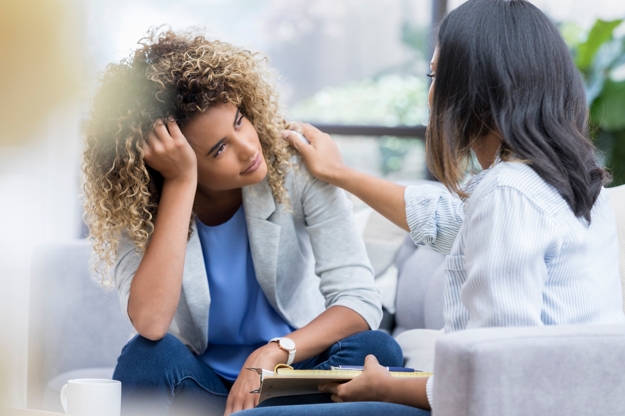 Sad woman speaking to heath care provider