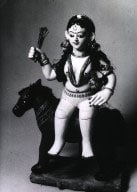 An Indian figurine of a goddess believed to be the cause and cure of smallpox.