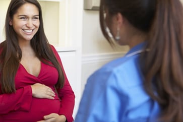 photo of pregnant woman and healthcare professional