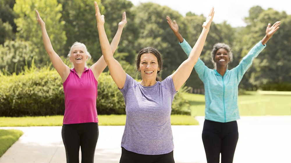 Older women exercising outdoors