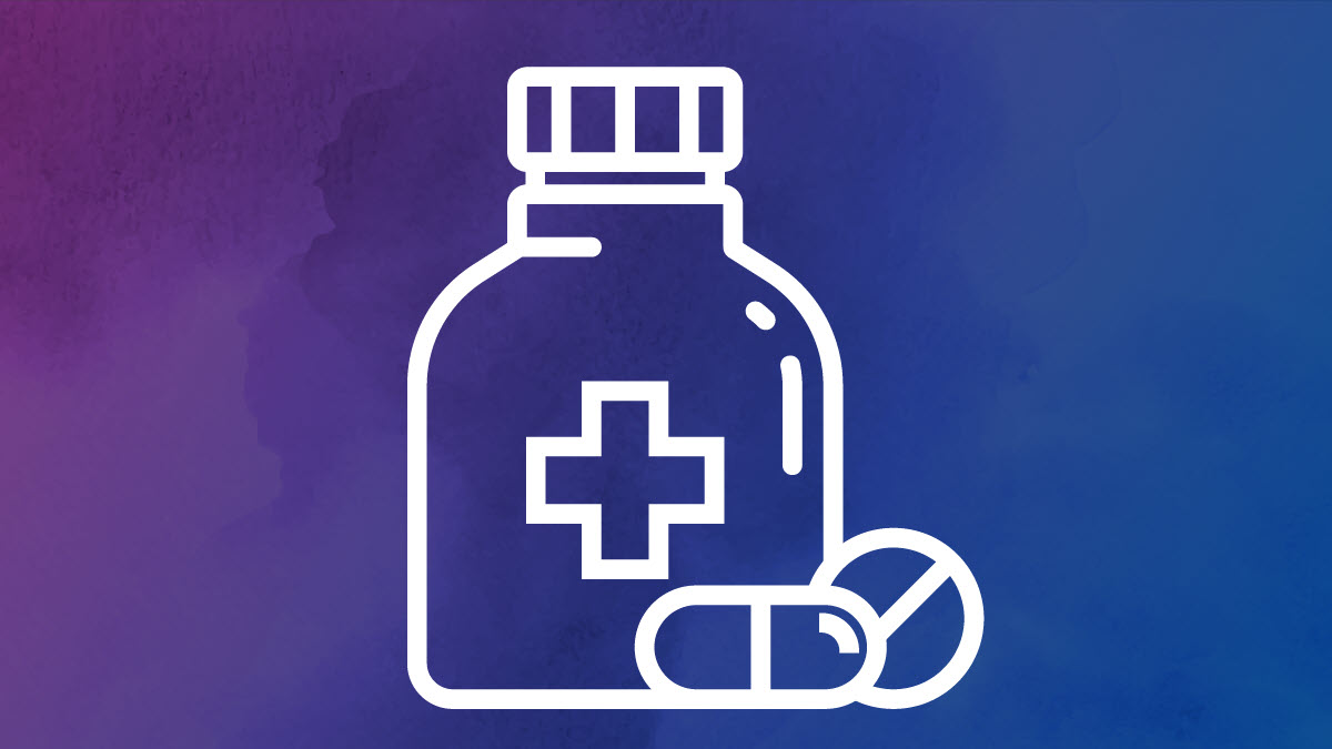 Pill bottle with a tablet pill and a round pill in from of the bottle