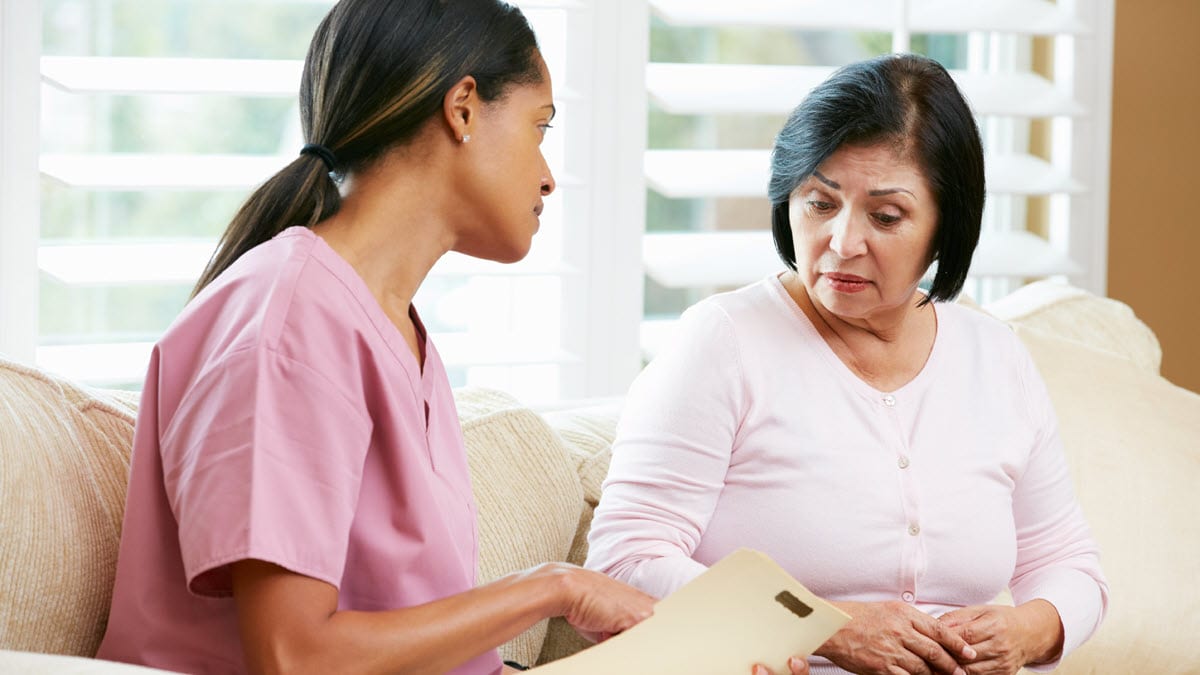 A female provider reviews information with female patient