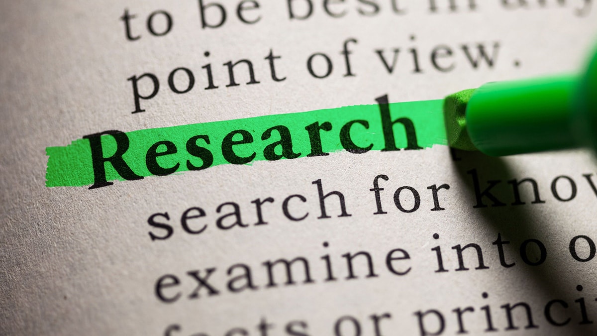 An image of the word "research" being highighted in green.