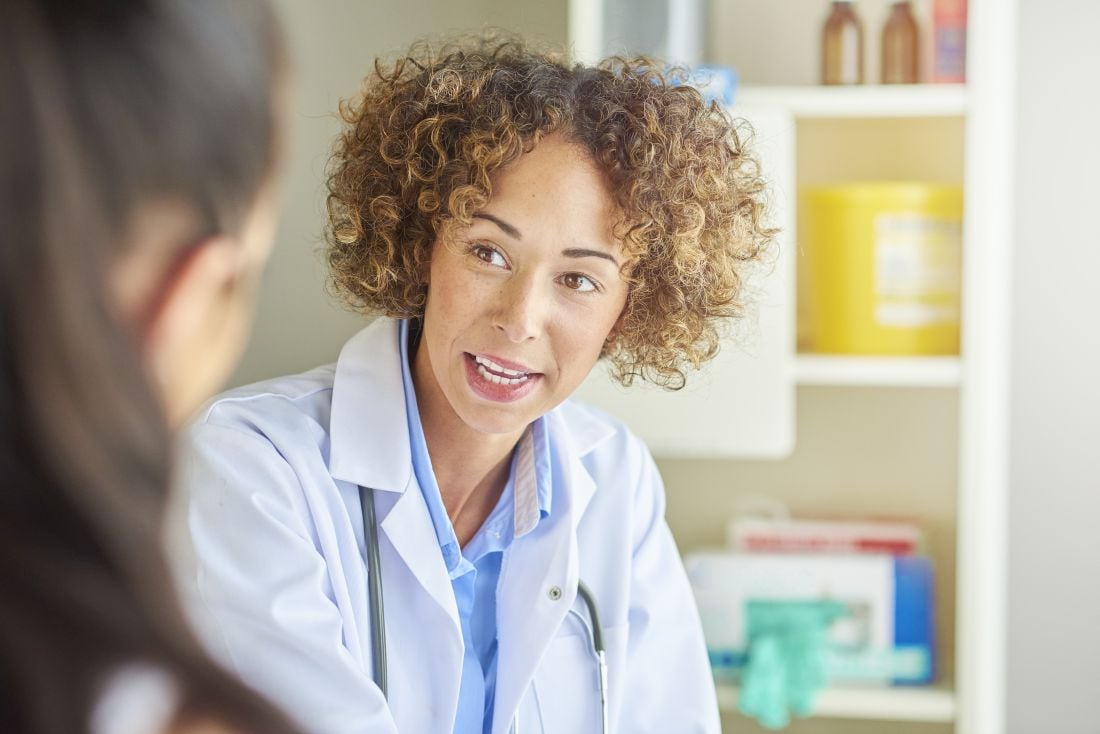 Female healthcare provider talking to patient
