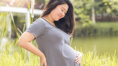 Pregnant woman outside