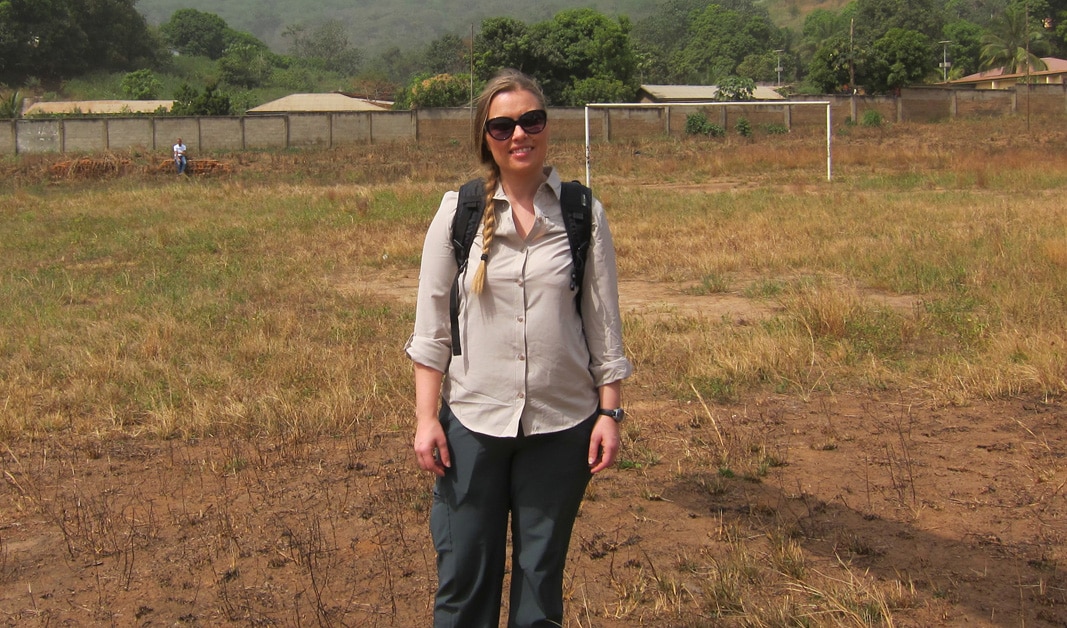Dana Haberling standing in a field in Africa