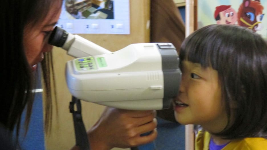 Young child getting an eyesight screening